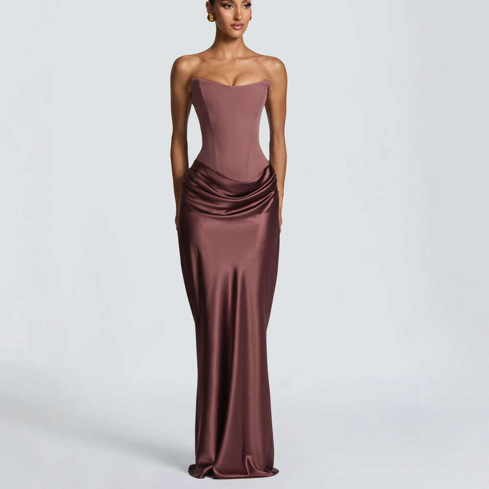 Spring 2026 Women's Collection: Seductive fishbone strapless dress with a cinched waist, adorned with ribbons and a satin pencil skirt.