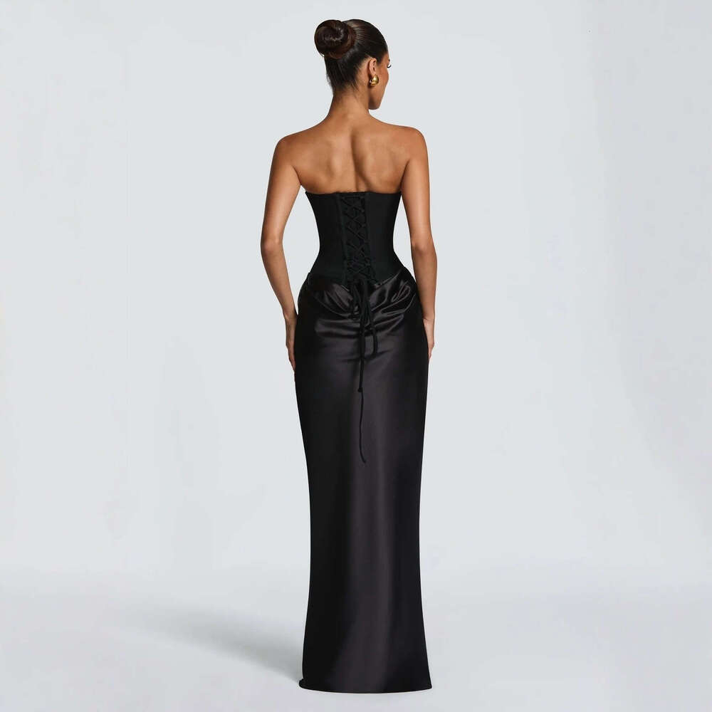 Spring 2026 Women's Collection: Seductive fishbone strapless dress with a cinched waist, adorned with ribbons and a satin pencil skirt.