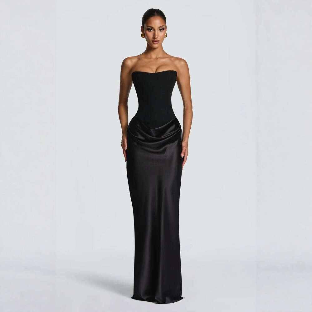 Spring 2026 Women's Collection: Seductive fishbone strapless dress with a cinched waist, adorned with ribbons and a satin pencil skirt.
