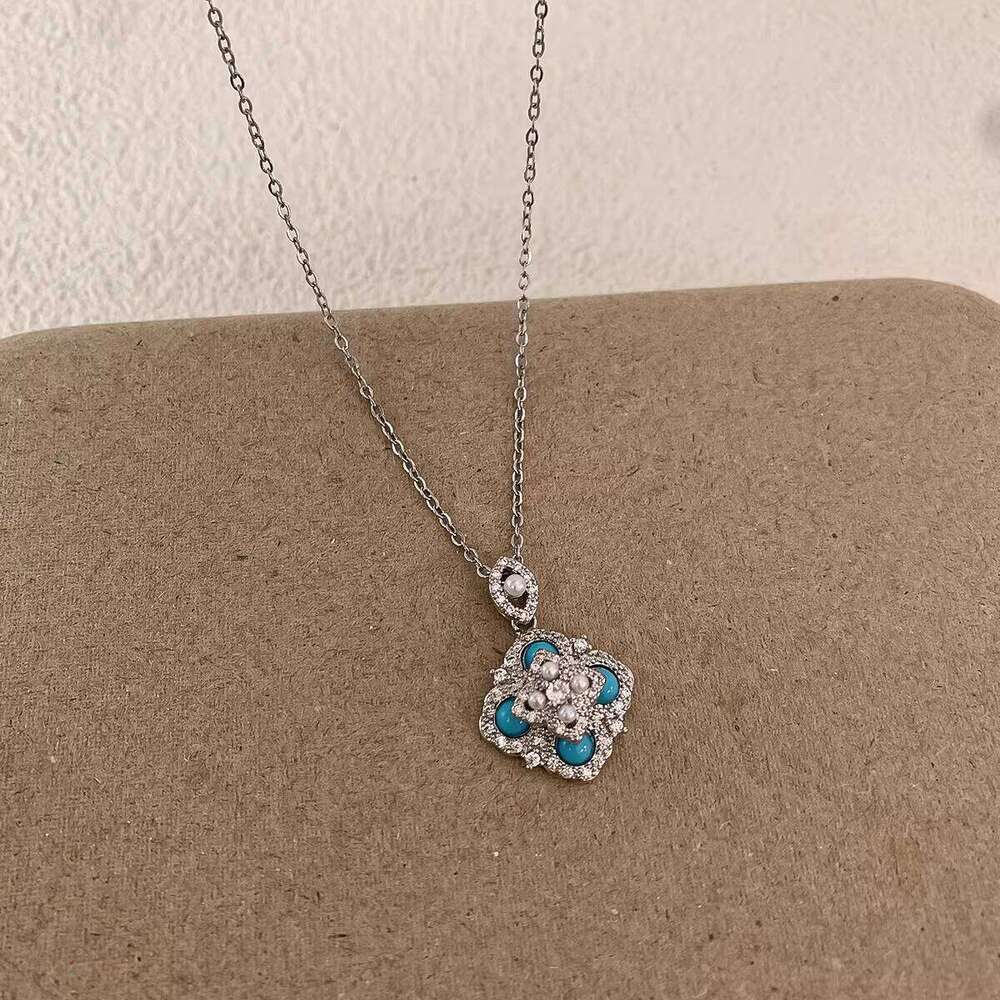 Exquisite micro-inlaid zircon turquoise four-leaf flower pearl earrings and necklace for women, fashionable niche light luxury elegant jewelry
