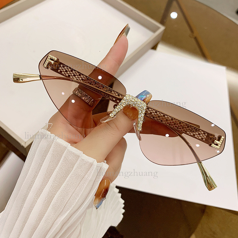 2026 New Designer Frameless Cat Eye Sunglasses Luxury Fashion Hollow Metal Outdoor Glasses Trendy Brand Diamond Inlaid Letters Outdoor Sports Glasses Wholesale