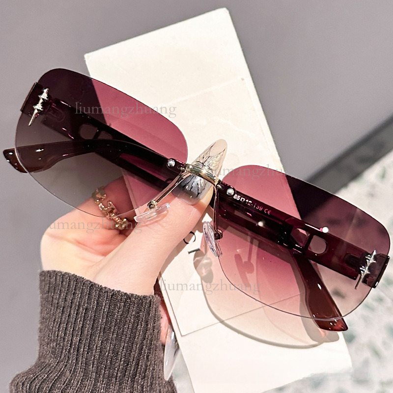 2026 Designer Luxury Brand Frameless Temperament Outdoor Glasses Fashion Trend High-end Cutting Edge Women's Sunglasses Street Photography Vacation Wholesale