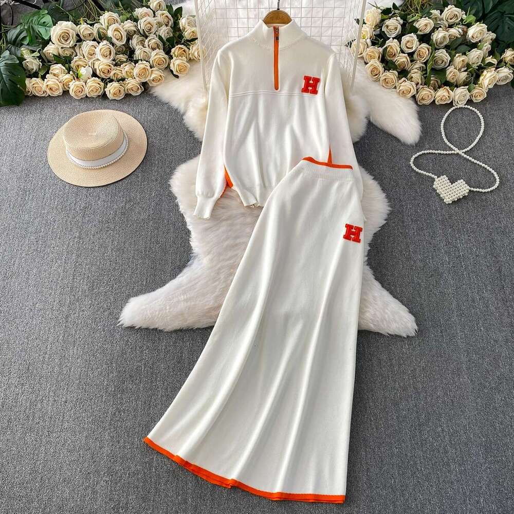 Autumn And Winter Slimming Outfit: Zippered Half-High Collar Long-Sleeve Knitted Sweatshirt + Contrasting Color High-Waisted Mid-Length Skirt Set