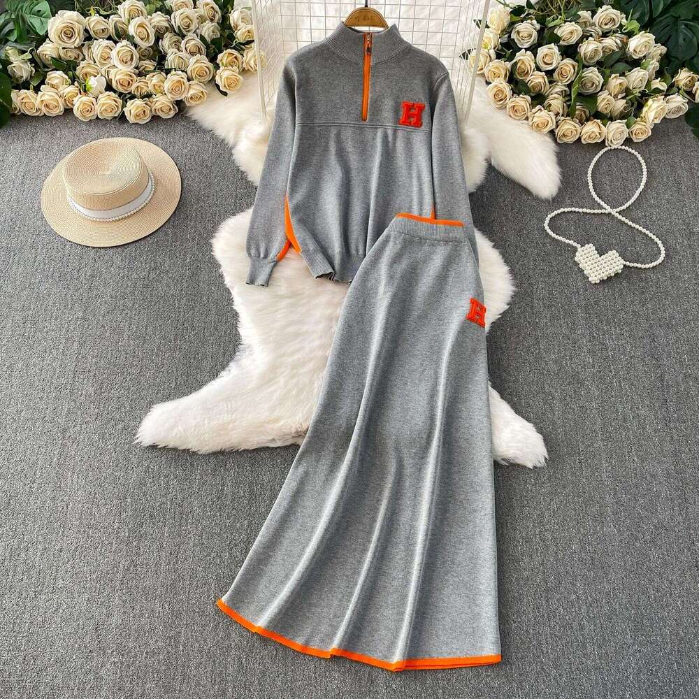 Autumn And Winter Slimming Outfit: Zippered Half-High Collar Long-Sleeve Knitted Sweatshirt + Contrasting Color High-Waisted Mid-Length Skirt Set