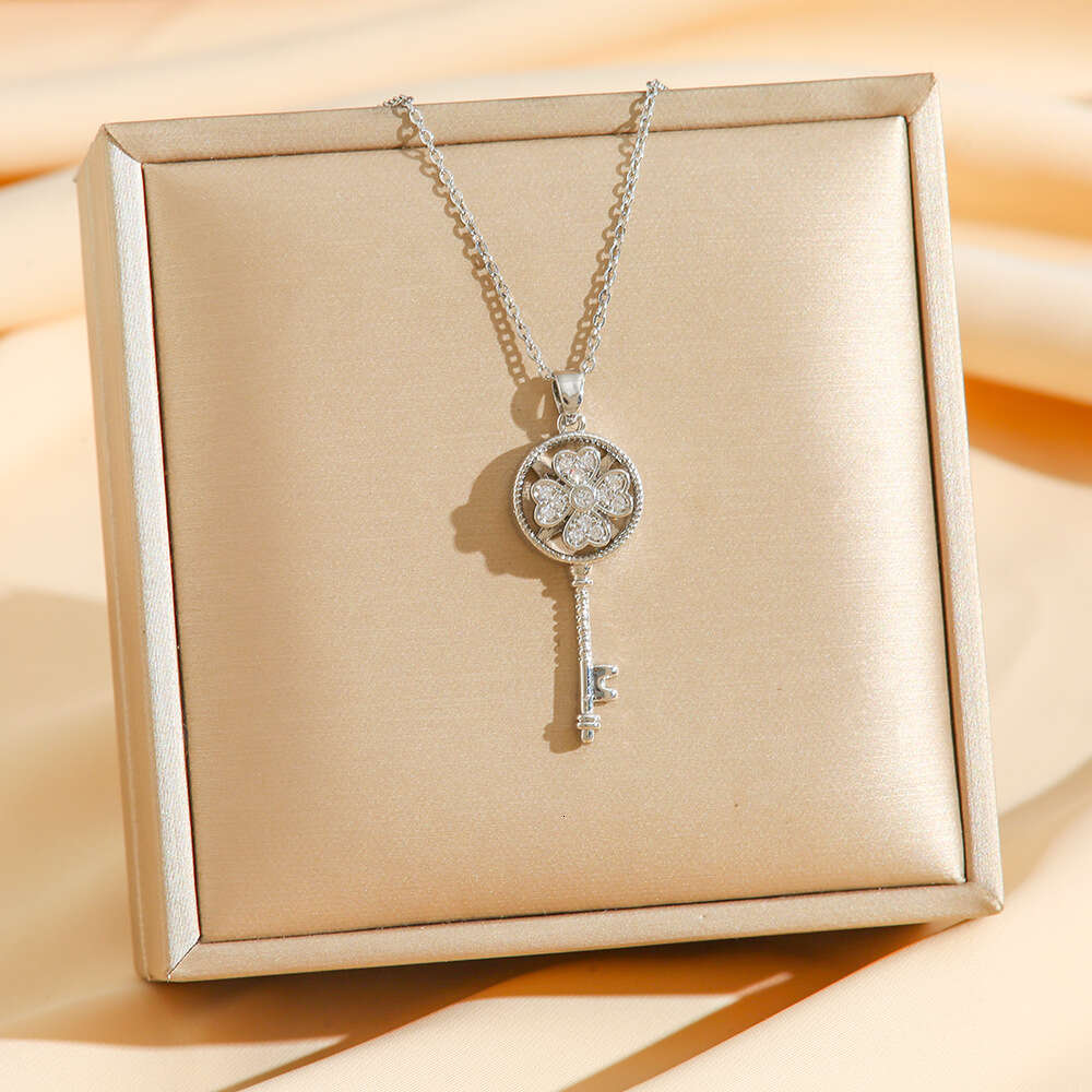Rotating Four-Leaf Clover Key Pendant With Micro-Inlaid Zirconia Rotatable Titanium Steel Necklace For Women