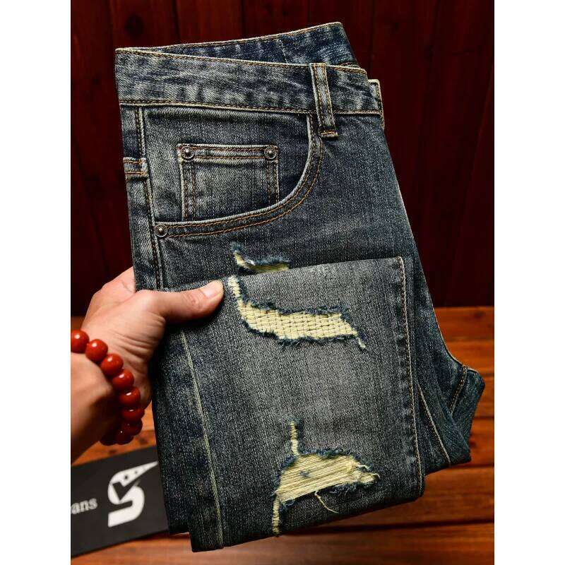 2026 New Broken hole patch jeans for men 2025, scraped slim fit, small foot design, trendy fashion, retro blue denim pants Q260225