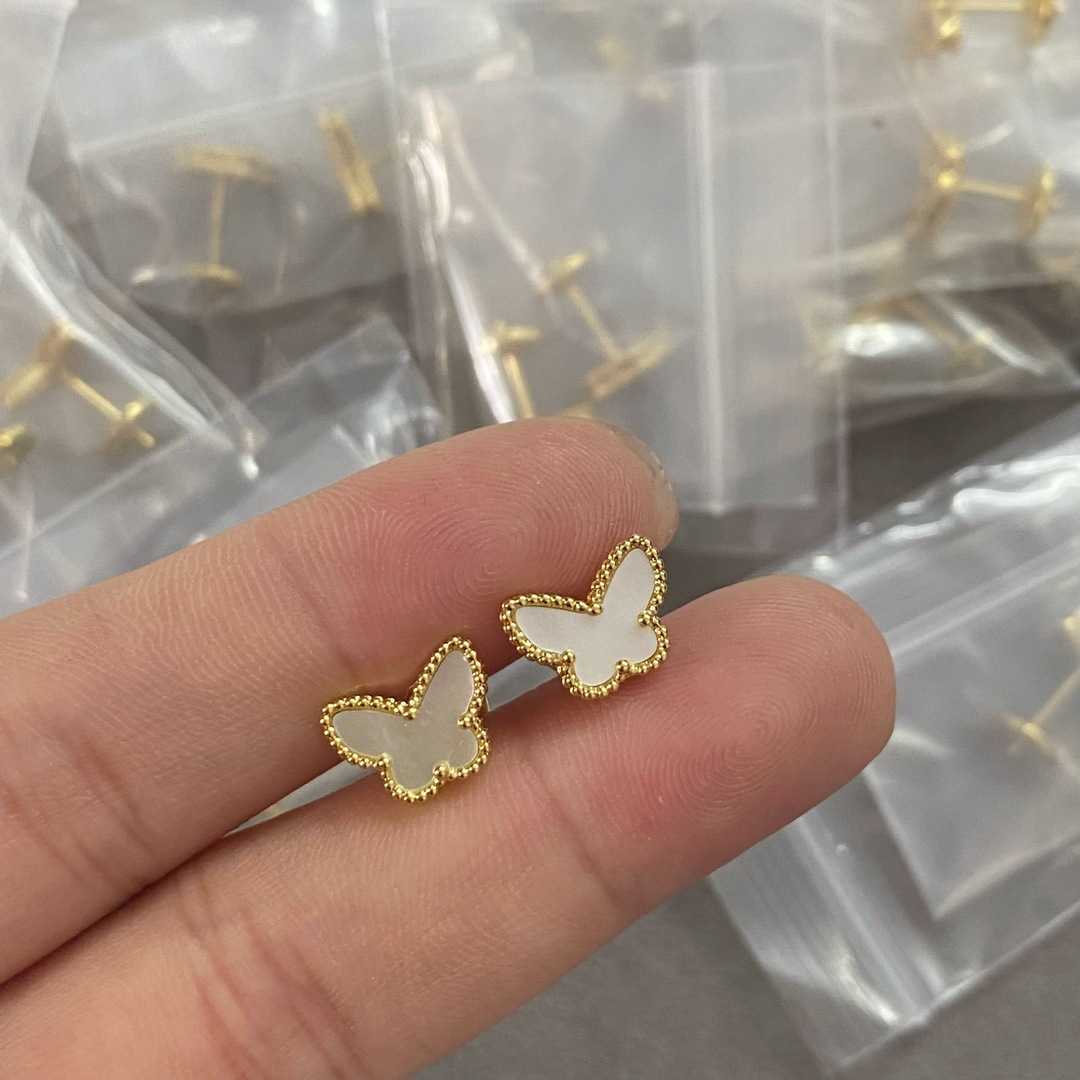 Small white shell butterfly stud earrings are hand-set with exquisite golden yellow earrings Q260225