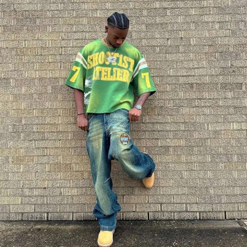 Men's T-shirt Trendy Distressed Eagle Letter Dark Green Base With Retro Yellow Letter Print Contrasting Striped Shoulder Details