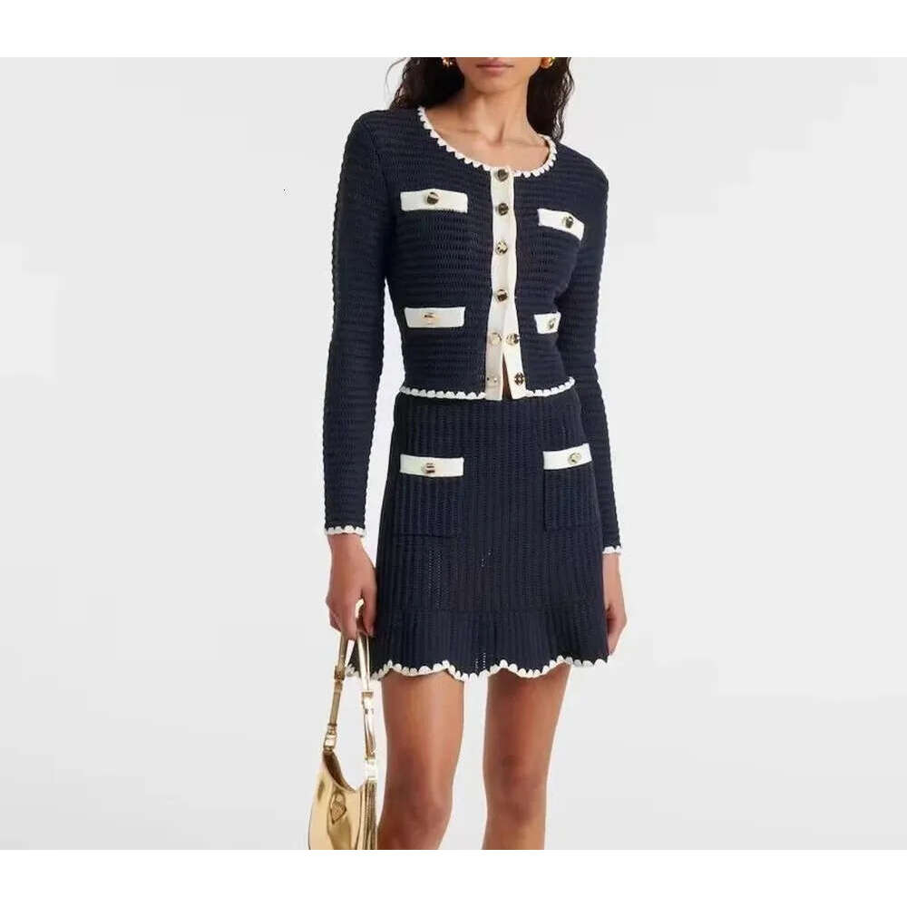 High quality French contrasting round neck top with irregular edges, waist cinching, half skirt, knitted two-piece set 2026