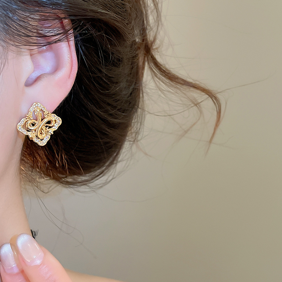 Silver needle zircon diamond-shaped hollow iris flower stud earrings, French vintage style, niche earrings with a light luxury and high-end feel - view 3