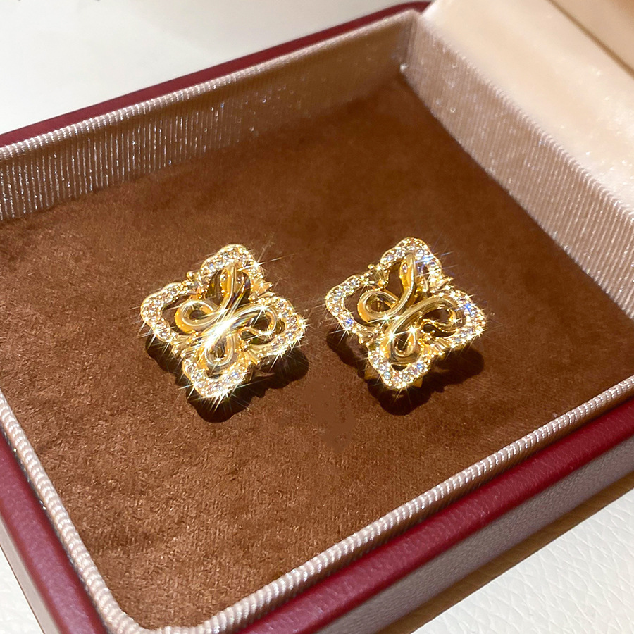 Silver needle zircon diamond-shaped hollow iris flower stud earrings, French vintage style, niche earrings with a light luxury and high-end feel - view 4