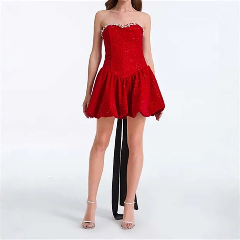 a2 Design an elegant and sexy strapless dress for autumn and winter 2026, paired with a shiny rhinestone sequin bow