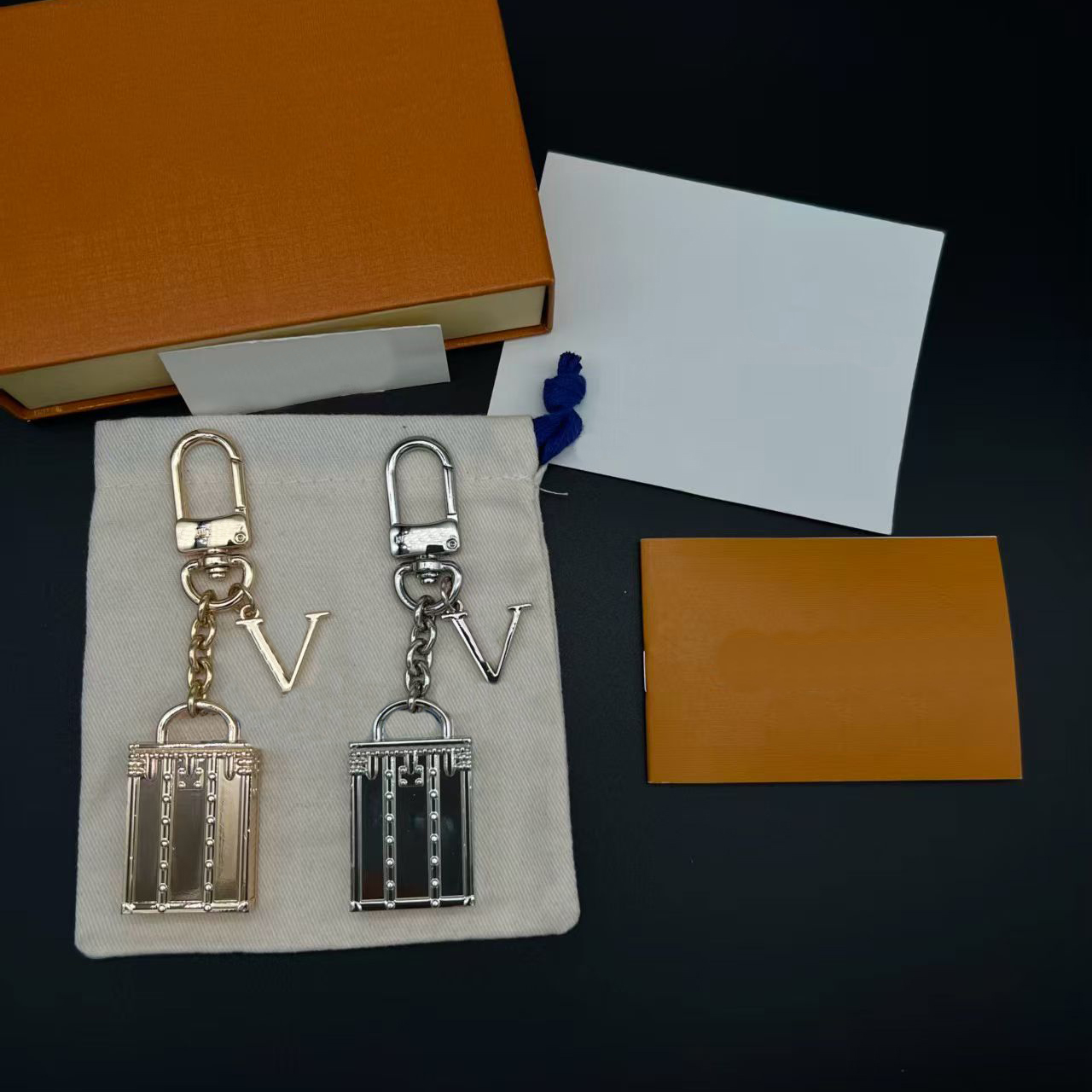 Gold-Tone Metal Keychain with Mini Trunk & Letter V Charms Elegant Daily Bag Accessory Gift for Loved Ones