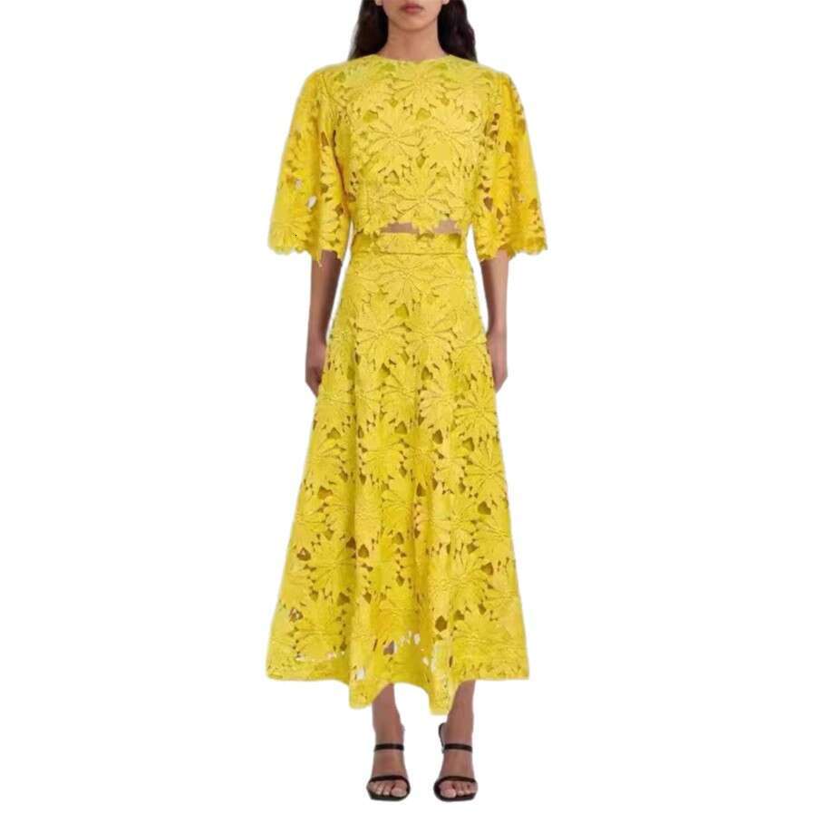 Summer 2026 European and American women's niche daisy a2 hollow lace bell sleeves short top big hem mid skirt vacation set