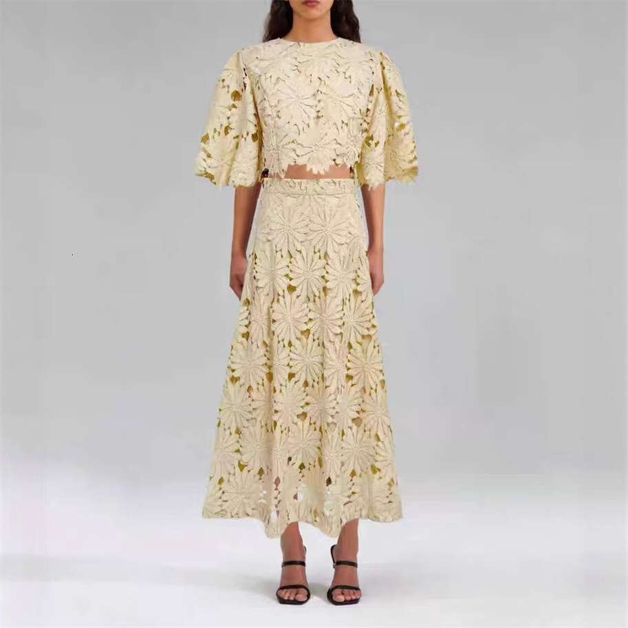 Summer 2026 European and American women's niche daisy hollow lace bell sleeves short top big hem mid skirt a3 vacation set