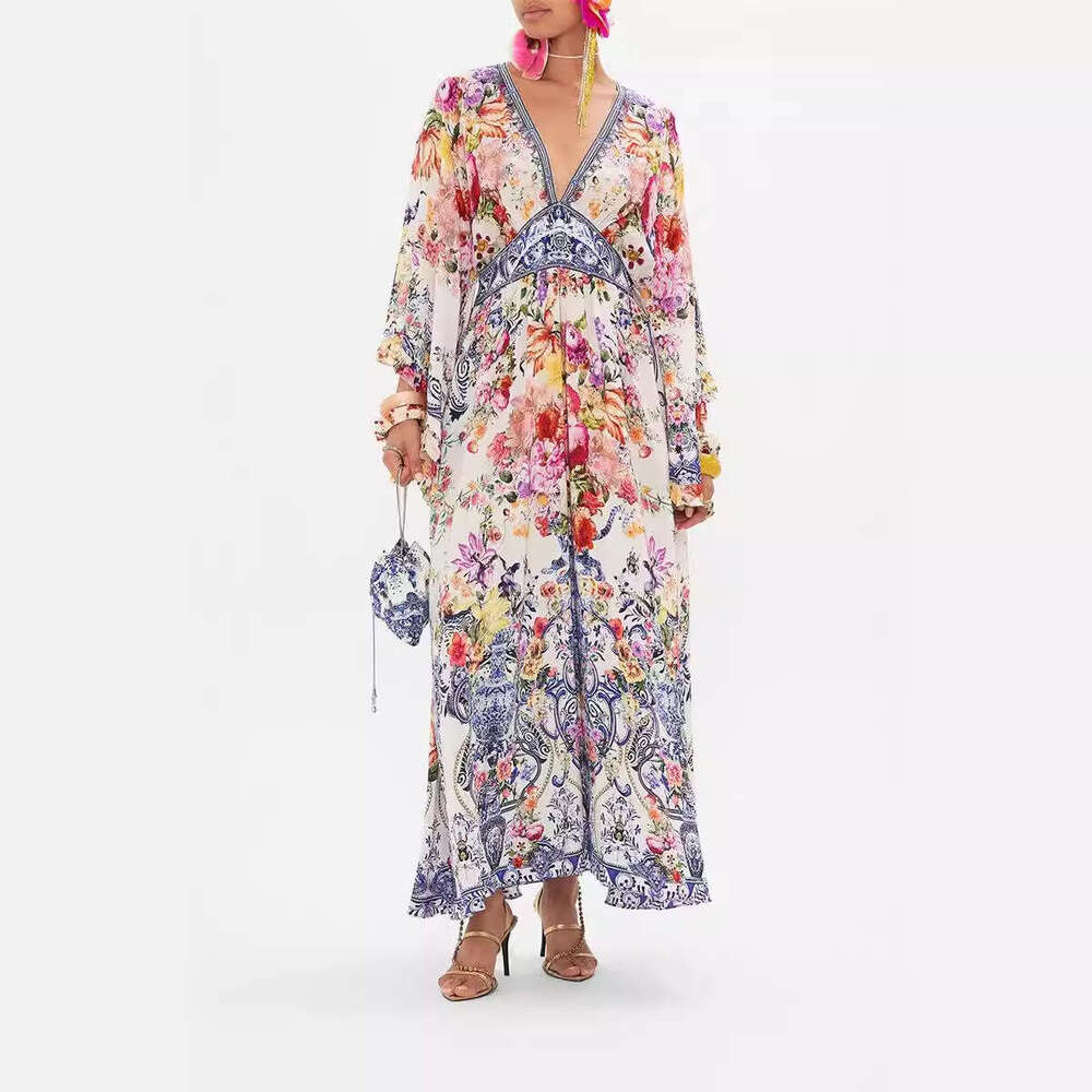 2026 autumn and winter new niche fairy print V-neck bell A1 shaped sleeves elegant goddess vacation long skirt