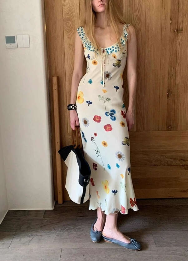 2026 new European and American niche vacation style fresh thin shoulder strap U-neck painted print slim fish tail long skirt