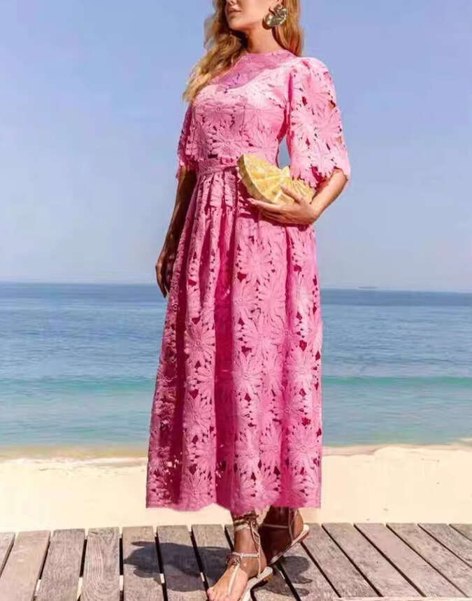 Summer 2026 European and American women's niche daisy a2 hollow lace bell sleeves short top big hem mid skirt vacation set