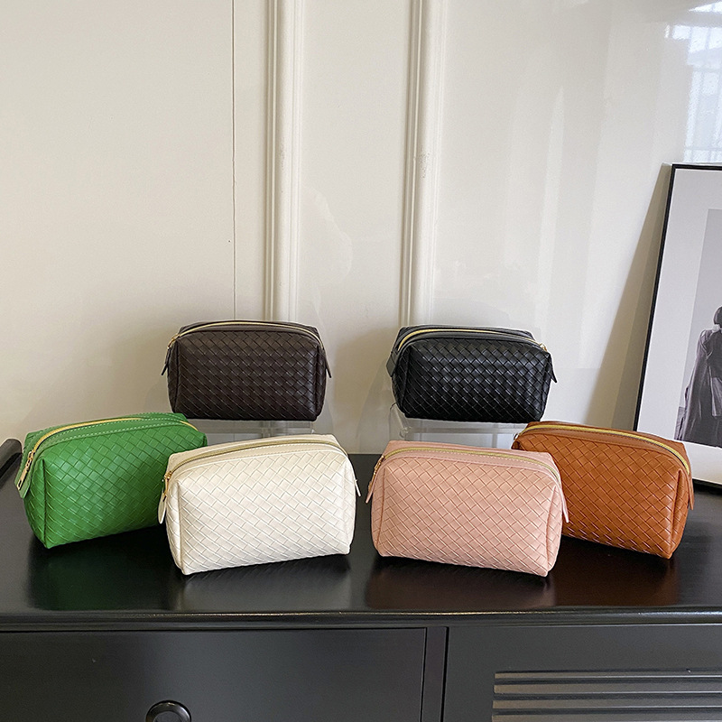 cosmetic bag designer 2026 New Woven Texture Cosmetic Bag, Portable High-End Leather Handbag, Small Soft Makeup Organizer Pouch
