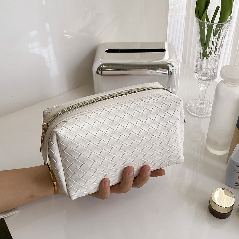 cosmetic bag designer 2026 New Woven Texture Cosmetic Bag, Portable High-End Leather Handbag, Small Soft Makeup Organizer Pouch