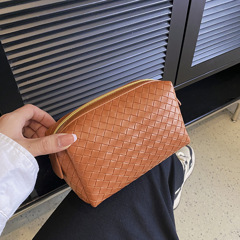 cosmetic bag designer 2026 New Woven Texture Cosmetic Bag, Portable High-End Leather Handbag, Small Soft Makeup Organizer Pouch