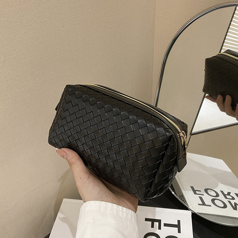 cosmetic bag designer 2026 New Woven Texture Cosmetic Bag, Portable High-End Leather Handbag, Small Soft Makeup Organizer Pouch