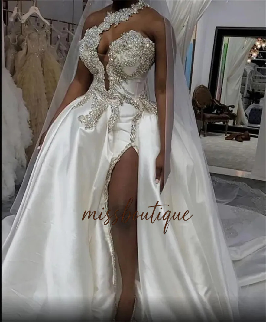 Luxury Crystals High Split Wedding Dresses One Shoulder Bridal Gowns With Overskirt African Sexy Satin Court Train Custom Made Robe De Mariee Q626