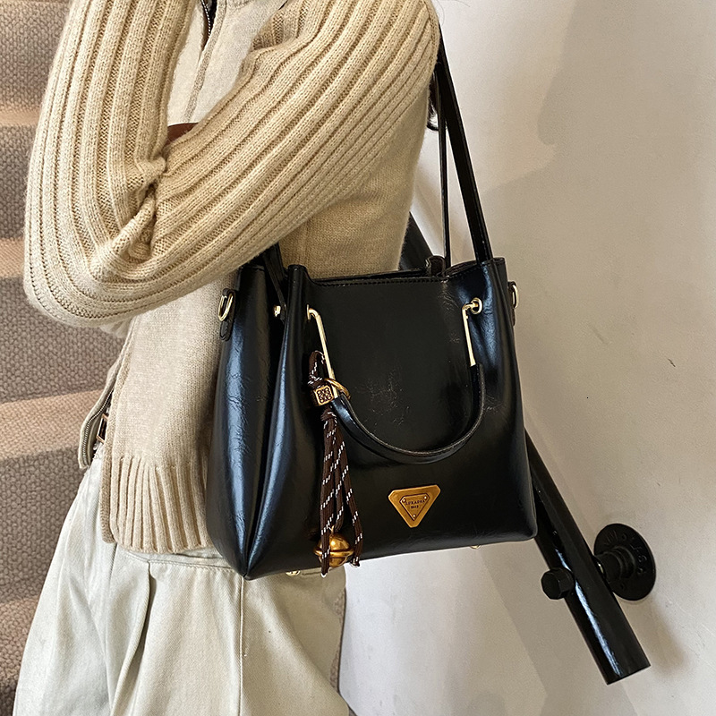 Vintage Oil Wax Leather Bucket Handbag Dual Handle Crossbody Bag With Bell Tassel Charm For Women Daily Work - view 4