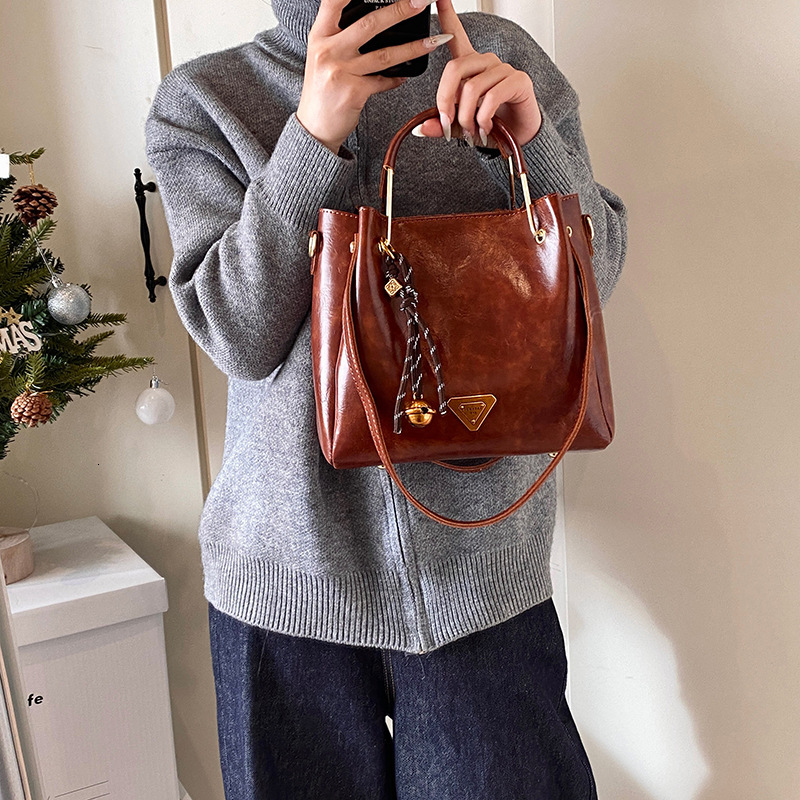 Vintage Oil Wax Leather Bucket Handbag Dual Handle Crossbody Bag With Bell Tassel Charm For Women Daily Work - view 5
