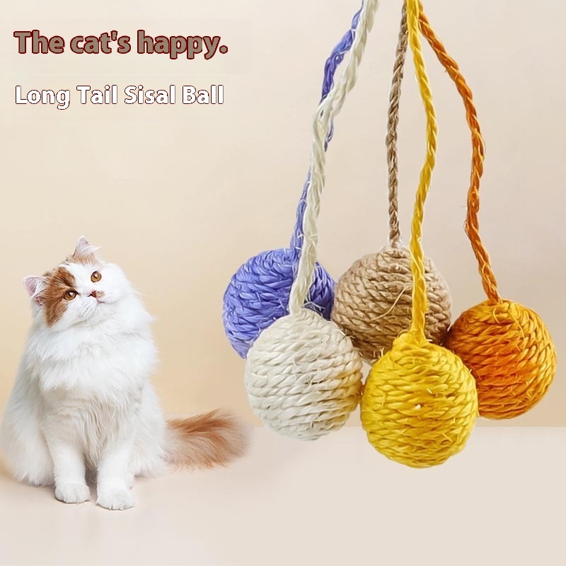 Cat with self satisfied, nibbg on multi-color playful cat toy, sisal ball, grinding teeth, making sound hemp rope tail ball