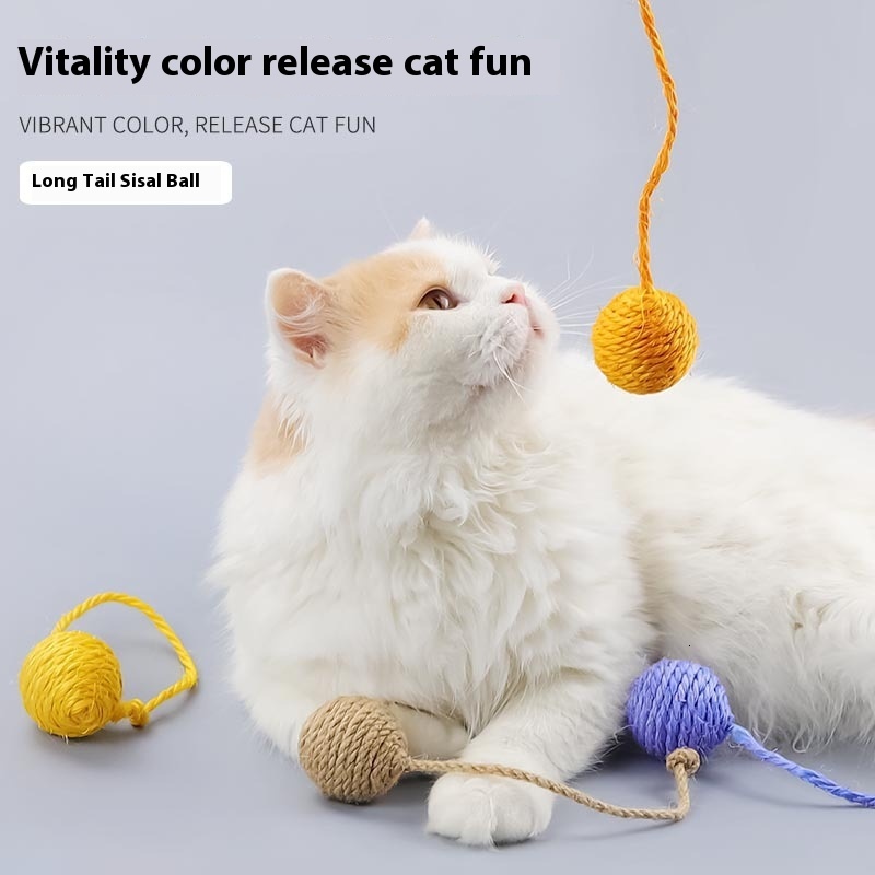 Cat with self satisfied, nibbg on multi-color playful cat toy, sisal ball, grinding teeth, making sound hemp rope tail ball