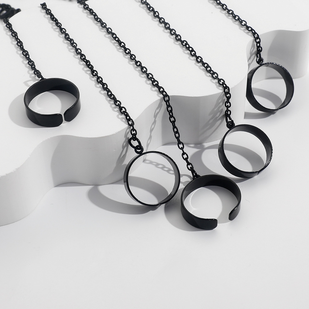 Stylish Link Bracelet and Interlocking Rings for a Trendy Punk Look