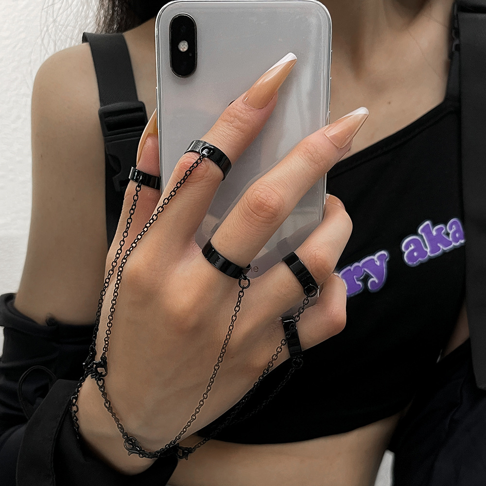 Stylish Link Bracelet and Interlocking Rings for a Trendy Punk Look