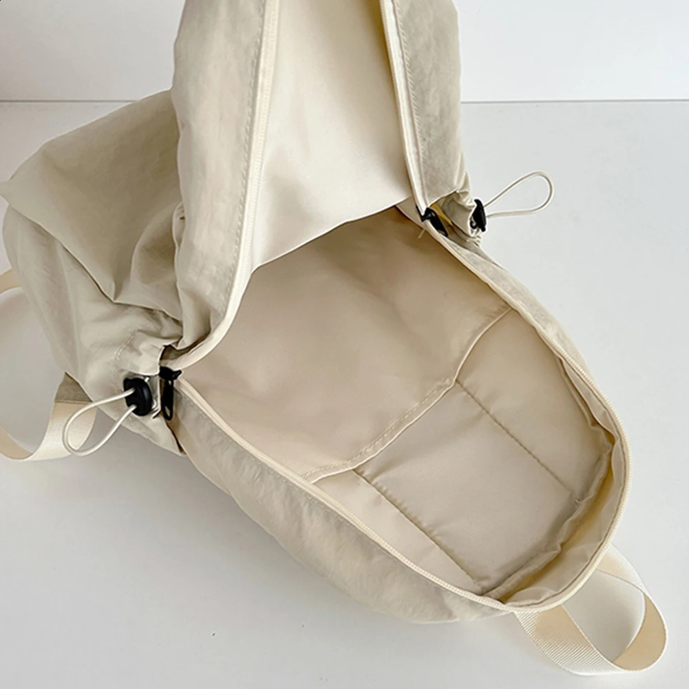 Large capacity school backpack for both boys and girls nylon drawstring lightweight with side pockets suitable travel sports 240906