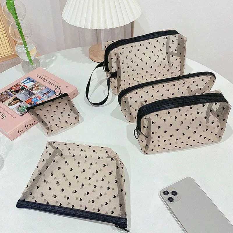 One fashionable transparent mesh cosmetic bag Womens heart mini cosmetic lipstick storage bag Breathable travel toilet zipper bag W250109
