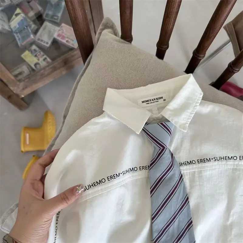 Childrens Shirts 2023 Spring And Autumn New Boys And Girls Letter Tie Long Sleeve Baby Academy Style Simple White Shirt Trend Y240906