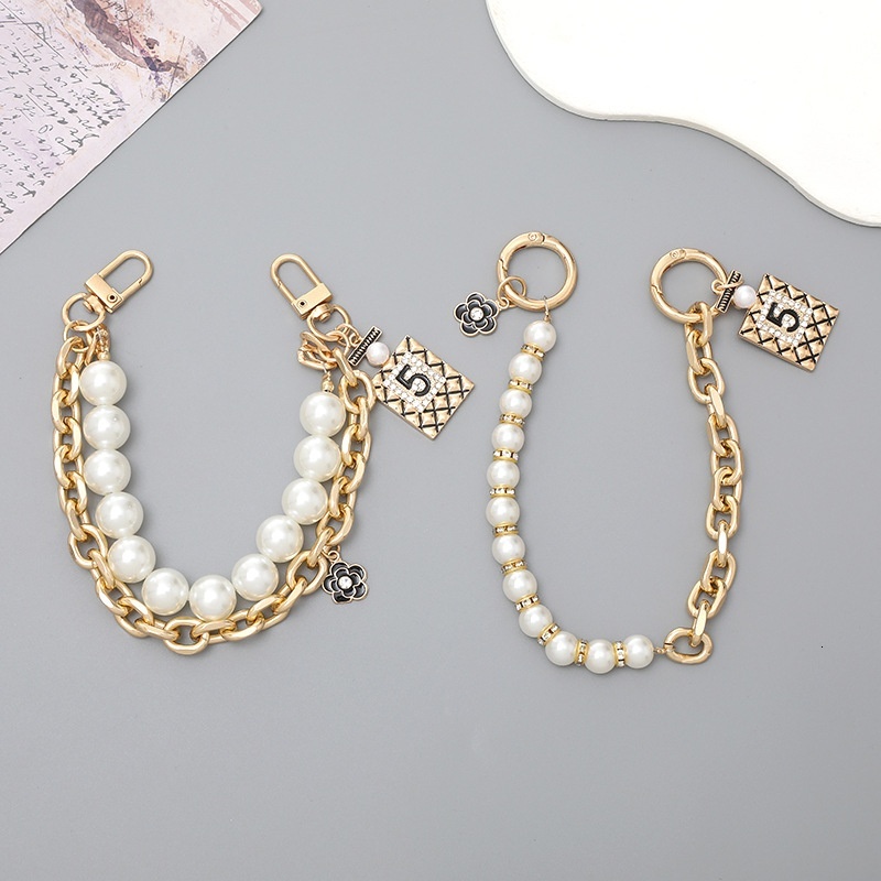 Yi Lian's New Xiaoxiangfeng Pearl Handheld Double Bag Bracelet Phone Case Keychain Anti drop Chain