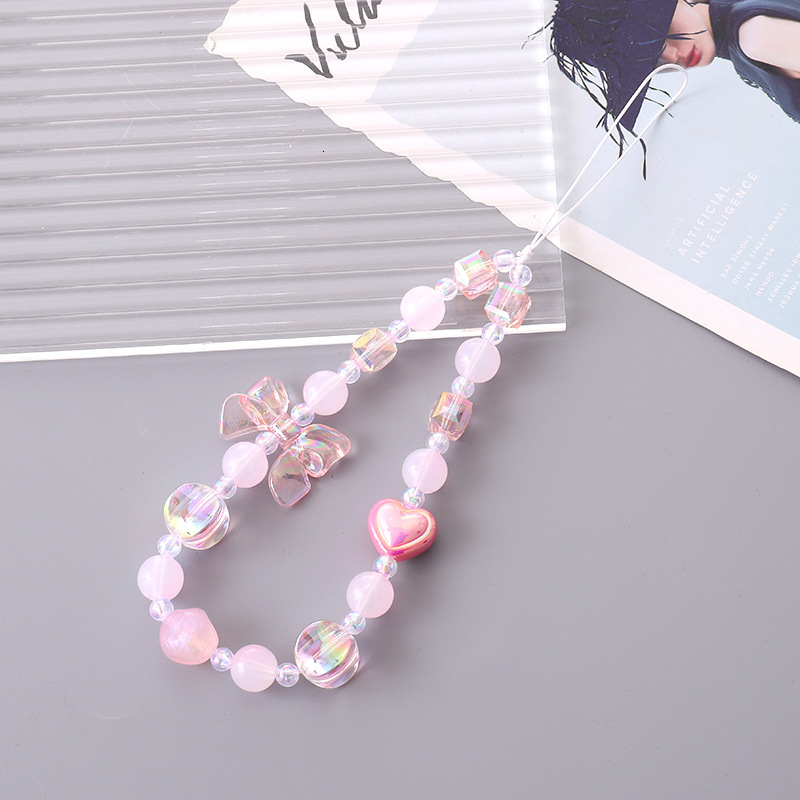 Yilian's new color plated bow mobile chain fashionable, small, fresh. The phone case has a hanging rope that prevents loss falls, and the wrist s