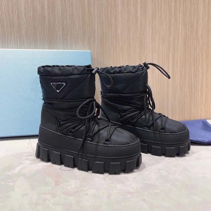 Nylon gabardine apres ski boots Black 1U007N Upper with drawstring Removable padded pile lining Enameled metal triangle logo booties rubber sole designer ski boots