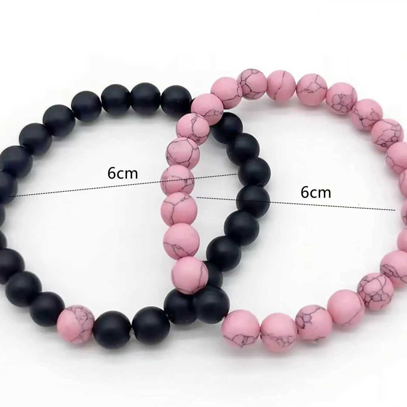 2 pairs of pink and black bead bracelet sets W240913