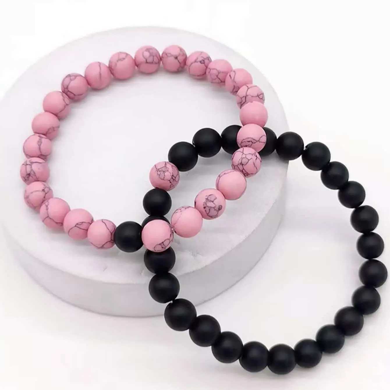 2 pairs of pink and black bead bracelet sets W240913