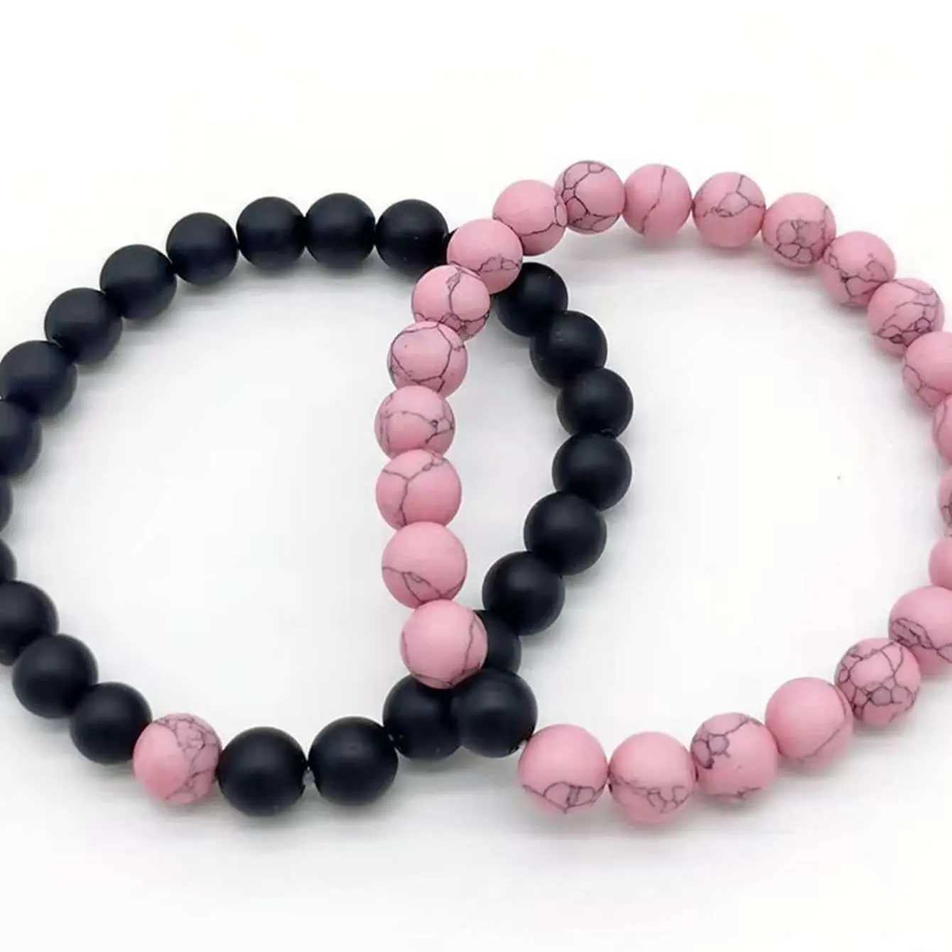 2 pairs of pink and black bead bracelet sets W240913