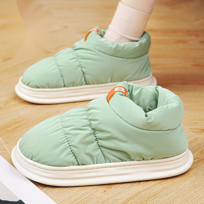 Mid top down cloth covered couples in winter, with plush candy colored cotton shoes for outer wear, warm and casual snow boots