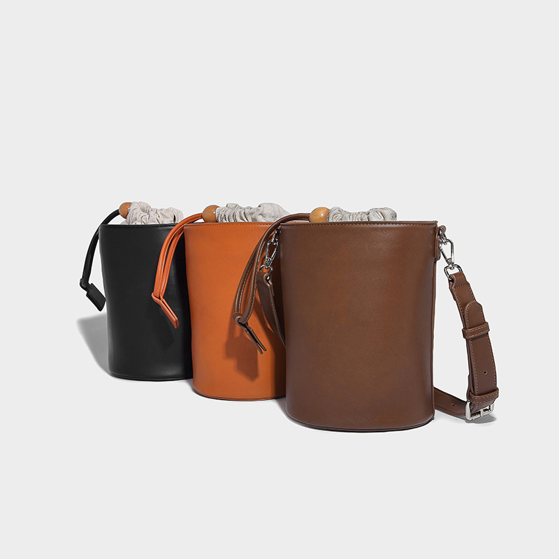 New Solid Color Drawstring Mini Bucket for Women 2024 Commuter Cylinder Texture Single Shoulder Handheld Crossbody Bag