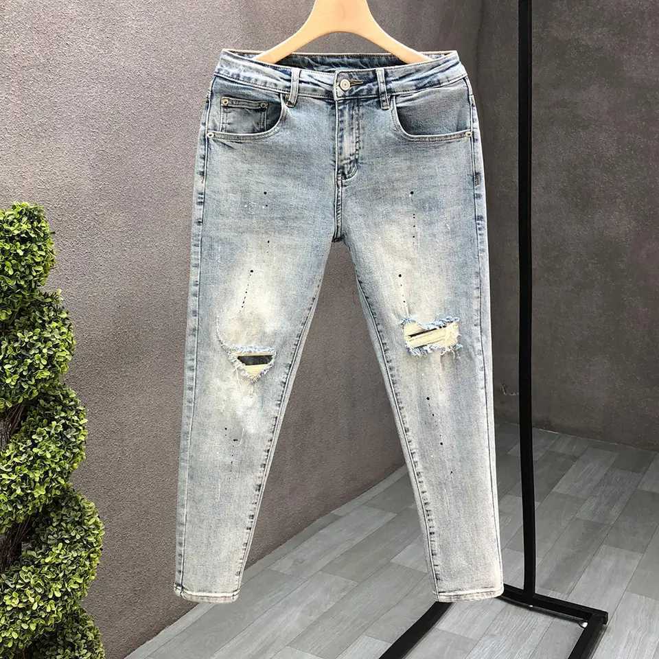 Fashion designer mens slim fit jeans with ink splatter and cracked holes suitable for spring and autumn casual wear strict fashion pencil pants CL2409