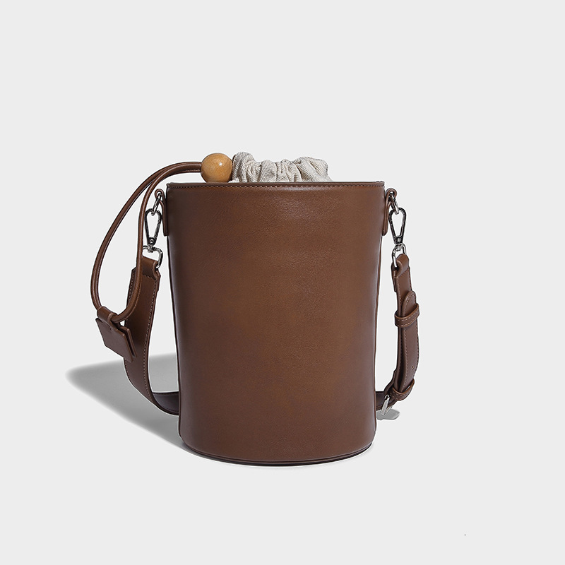 New Solid Color Drawstring Mini Bucket for Women 2024 Commuter Cylinder Texture Single Shoulder Handheld Crossbody Bag