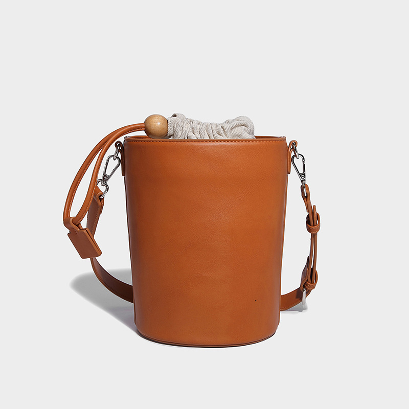 New Solid Color Drawstring Mini Bucket for Women 2024 Commuter Cylinder Texture Single Shoulder Handheld Crossbody Bag