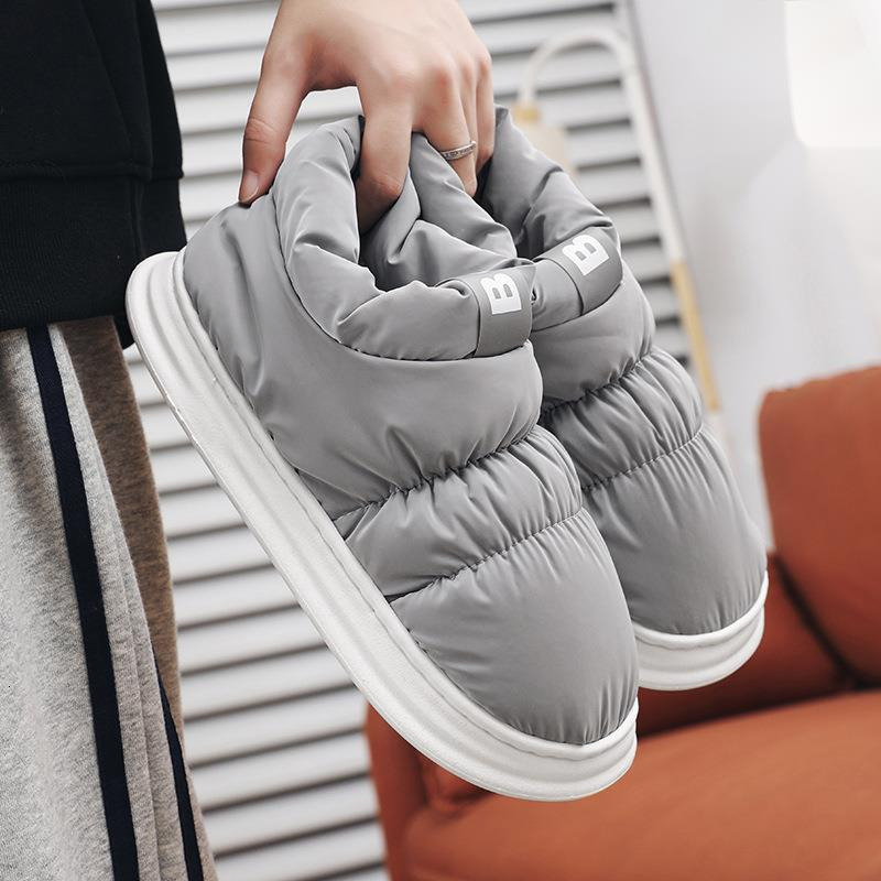 Mid top down cloth covered couples in winter, with plush candy colored cotton shoes for outer wear, warm and casual snow boots