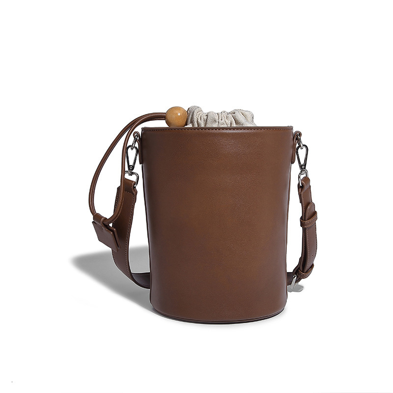New Solid Color Drawstring Mini Bucket for Women 2024 Commuter Cylinder Texture Single Shoulder Handheld Crossbody Bag