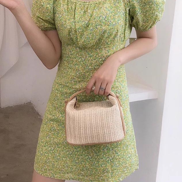 Water bucket wrapped grass woven small casual women's hand-held one shoulder crossbody bag, new for spring 2024